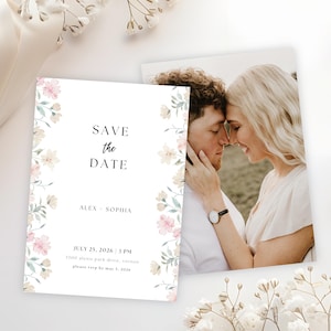May include: A wedding announcement card with the text "Save the Date" and the names "Alex - Sophia". The card features a floral border with pink and cream-colored flowers. A photograph of a couple is visible.