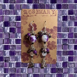 May include: A rustic wooden sign with the text "Welcome to our home" in white lettering. The sign features a distressed finish and a simple, inviting design, perfect for a front porch or entryway.