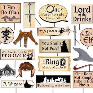 May include: A collection of themed photo booth props featuring quotes and imagery from a fantasy novel. Includes signs with phrases like "One Party to Rule Them All" and "You Shall Not Pass!" along with character-related props.