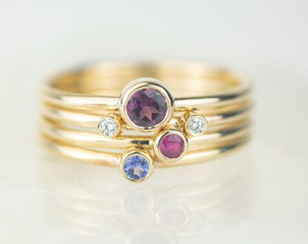 Lupus - Rhodolite Garnet, Ruby, Tanzanite and Diamond Gold Andromeda  Stacking Ring Set