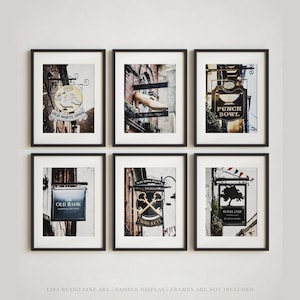 May include: Six framed prints featuring vintage pub signs. The signs include "Old White Swan", "Punch Bowl", "The Old Bank", "Cross Keys", and "Royal Oak". The prints are displayed against a neutral background, with the text "LISA RUSSO FINE ART" at the bottom.