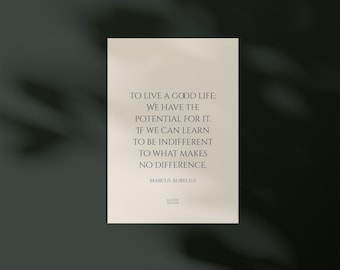 May include: A rectangular print with the quote "TO LIVE A GOOD LIFE: WE HAVE THE POTENTIAL FOR IT. IF WE CAN LEARN TO BE INDIFFERENT TO WHAT MAKES NO DIFFERENCE." by Marcus Aurelius. The print is on a cream background.