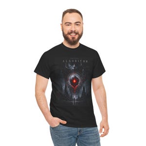 May include: A black short-sleeve t-shirt featuring a graphic print with the text THE LAST ALGORITHM. The design depicts a dark, futuristic cityscape with a glowing red core at the center, surrounded by intricate mechanical details and shadows.