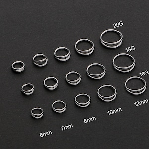 Peut inclure: Collection d'anneaux de nez et de piercings d'oreilles doubles argentés de différentes tailles. Les tailles sont indiquées en mesures telles que 6 mm, 7 mm, 8 mm, 10 mm et 12 mm, et jauges 16G, 18G et 20G.