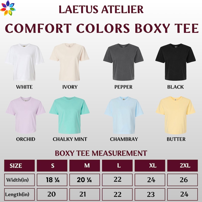 Op de afbeelding: Een display van acht Comfort Colors Boxy T-shirts in verschillende kleuren, waaronder wit, ivoor, peper en zwart. De afbeelding toont ook de afmetingen voor elke maat, met breedtes vari&euml;rend van 46,36 cm tot 66,04 cm en lengtes van 50,8 cm tot 60,96 cm.