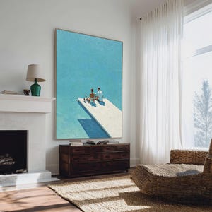 May include: A large framed painting depicts a serene scene of a white dock extending into a turquoise body of water. Two figures are seated on the dock, enjoying drinks. The artwork is displayed in a well-lit room with a fireplace and a wooden dresser.
