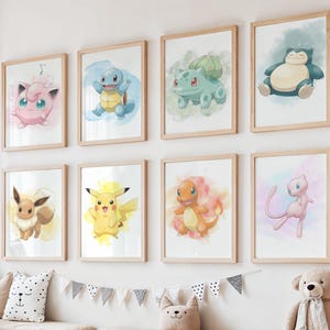 May include: Nine framed watercolor prints of Pokémon characters, including Jigglypuff, Squirtle, Bulbasaur, Snorlax, Eevee, Pikachu, Charmander, and Mew. The prints are displayed on a white wall above a wooden bench with baskets and stuffed animals.