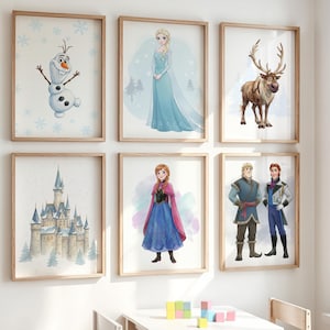 May include: Six framed watercolor prints featuring characters and scenes from the animated film "Frozen." The prints include images of Olaf, Elsa, a reindeer, Anna, Kristoff, and Hans, with a castle in the background. The frames are made of light-colored wood.