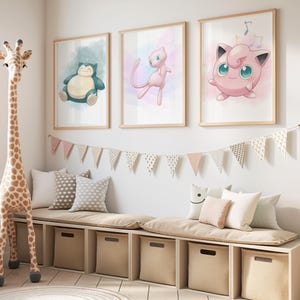 May include: Three framed watercolor prints of Pok&eacute;mon characters, including Snorlax, Mew, and Jigglypuff, hang above a built-in bench with storage cubes. A giraffe toy stands to the left, and a banner of pennants decorates the wall.