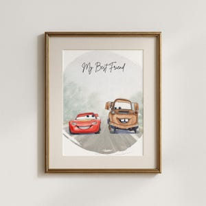 May include: Framed watercolor print featuring two cartoon cars, a red race car and a brown tow truck, on a road. The text "My Best Friend" is written above the cars. The artwork is set against a soft, watercolor background.