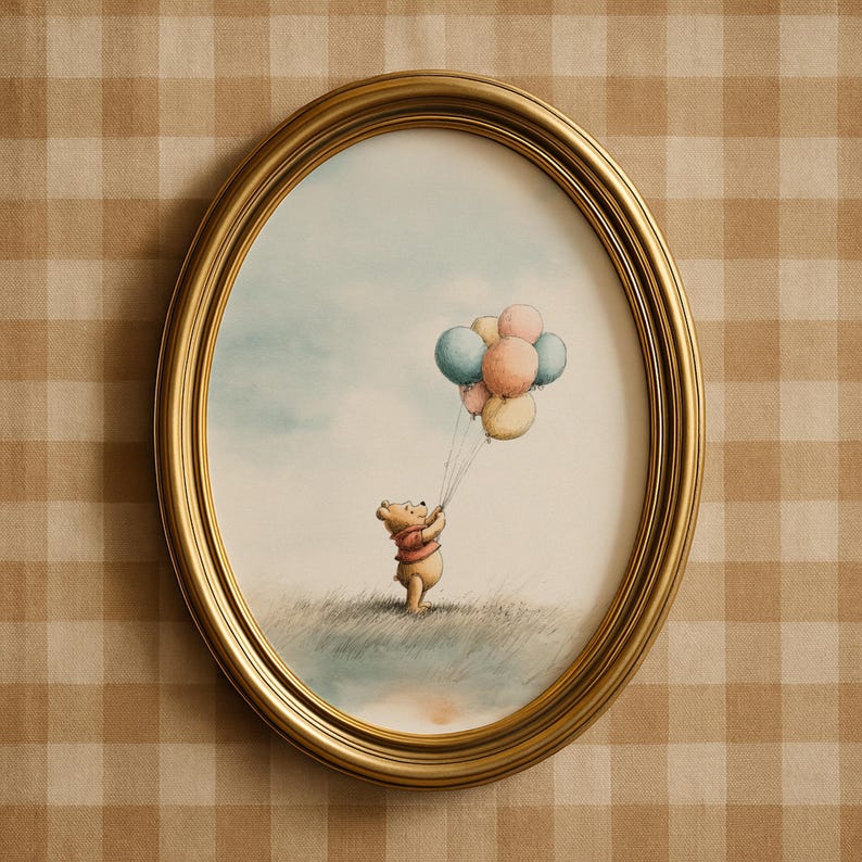 May include: An oval, gold-framed print featuring a watercolor illustration of a bear holding a bunch of pastel-colored balloons. The bear is standing in a grassy field under a light blue sky. The frame is a warm gold color.