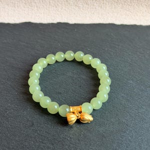 Soft Green Nephrite Jade Bracelet 8mm, Translucent “Qing Shui” Tone, Subtle Cat’s Eye Effect, Double Lotus Charm S925 Gold Plated, Fine Mini