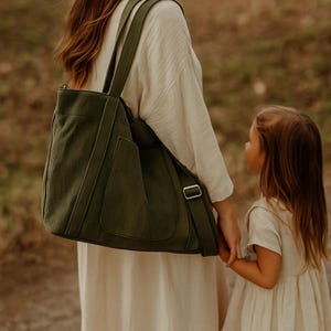 Women’s everyday corduroy tote bag with custom name, shown as a spacious casual handbag sized to fit notebooks; features shoulder or crossbody straps and works as a new mom’s essential items holder for kids’ and baby necessities.
