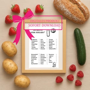 May include: A framed digital product print featuring a list of fruits and vegetables in German. The image includes strawberries, raspberries, potatoes, a cucumber, and a loaf of bread. A pink bow is attached to the frame.