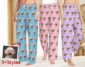 May include: Three pairs of pajama trousers in light blue, pink, and lavender, each patterned with a dog's face and the name "Sophia." The trousers have a drawstring waist. The image also shows a photo of the dog and the text "5+Styles."
