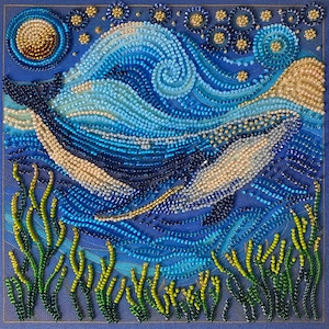 May include: A beaded artwork depicting a whale swimming in a sea with a starry night sky. The artwork uses shades of blue, white, and gold beads to create the ocean, whale, and celestial elements. Green and yellow beads form the seaweed.
