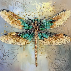 May include: A beaded dragonfly artwork. The wings are cream, gold, teal, and black. The dragonfly is on a light blue background with floral and leaf accents. Small gold beads are scattered around the dragonfly.