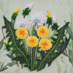 May include: A beaded artwork featuring a cluster of dandelions. The yellow flower heads have orange centers, and the seed heads are white. Green stems and leaves are also beaded, set against a light green watercolor background.