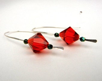 Red crystal earrings with emerald green Czech glass beads on sterling silver hammered wire