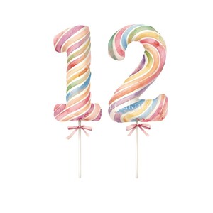 May include: Two cake toppers shaped as the numbers one and two, featuring a watercolor-style diagonal striped pattern in pastel shades of pink, blue, yellow, and green. Each number is attached to a white stick with a small pink ribbon bow.
