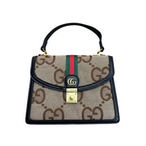 May include: A brown handbag with a black handle and trim. The bag features a repeating pattern of the letter "G" in a lighter brown color. A green and red stripe runs down the center. The bag has a gold-colored clasp.