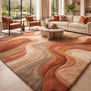 May include: A large rectangular area rug featuring a textured, multi-layered wave pattern in shades of burnt orange, terracotta, beige, and dark brown. The rug has a high-low pile construction that creates a three-dimensional effect across the surface.