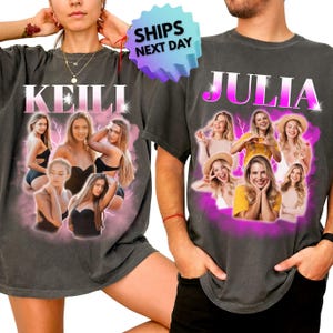 May include: Two charcoal gray t-shirts featuring custom photo collages and names printed in a pink and white gradient font. The left shirt displays the name KEILI above four photos of a person, while the right shirt displays the name JULIA above four photos of a person, both set against a vibrant pink lightning-style background.