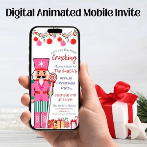 May include: A smartphone displays a digital Christmas party invitation. The invitation features a pink nutcracker holding a lollipop, with text that reads "Let's Get This Party Cracking" and event details. A wrapped gift with a red bow is in the background.