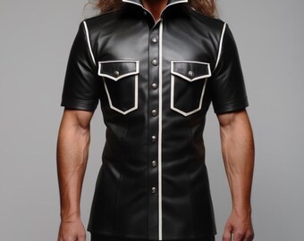 May include: Black leather short-sleeve shirt with white trim and two chest pockets. The shirt has a pointed collar and is buttoned down the front. The model is wearing black pants.