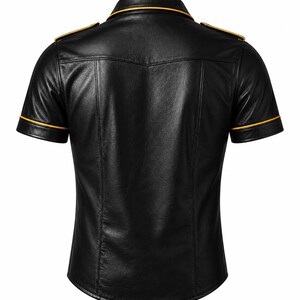 May include: Black short-sleeved shirt with a classic collar and gold trim. The shirt features epaulets on the shoulders and gold trim along the collar and sleeve edges. The shirt is made of a smooth, shiny material.