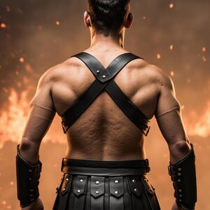 May include: A muscular figure is seen from the back, wearing black leather armor. The armor includes a harness, wrist cuffs, and a skirt-like bottom. The background is a fiery orange and brown, suggesting a battle or fantasy theme.