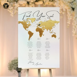 May include: A white wedding seating plan featuring a gold world map and the words "Find Your Seat". Guest names are listed by table. The names "Steven & Agostino" are at the bottom of the chart, displayed on a wooden easel.
