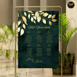 May include: A wedding seating chart with a dark green background and gold accents. The chart features gold leaf designs and the text "Find Your Seat." Names are listed under table numbers. The names "Steven & Agustine" are at the bottom.