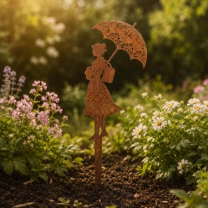 May include: A rust-colored metal garden stake featuring a silhouette of a person wearing a dress and carrying a bag while holding an open umbrella. The decorative figure has intricate cut-out patterns throughout the surface of the metal.