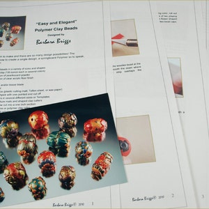 May include: A close-up of colorful polymer clay beads with intricate designs. The beads are arranged on a light blue surface. The image includes instructions for making the beads, titled "Easy and Elegant" Polymer Clay Beads, designed by Barbara Briggs.