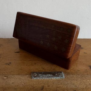 May include: A set of three ceramic mugs with a speckled, matte finish. The mugs are in shades of cream, light brown, and dark brown. Each mug has a simple, minimalist design, perfect for coffee or tea.