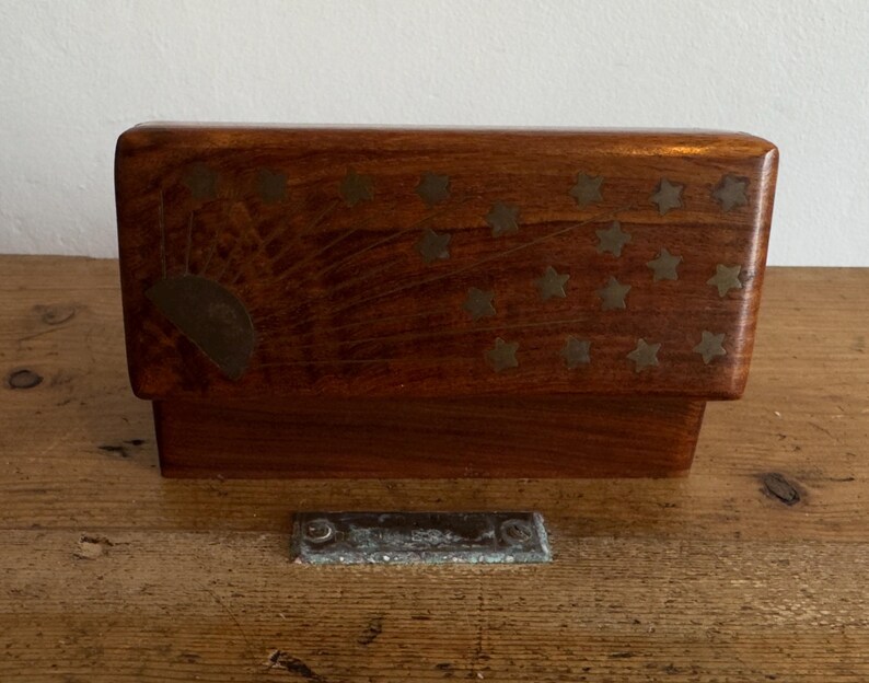 May include: A set of three ceramic mugs with a speckled, matte finish. The mugs are in shades of cream, light gray, and dark gray. Each mug has a simple, minimalist design and a rounded handle. The mugs are likely for coffee or tea.