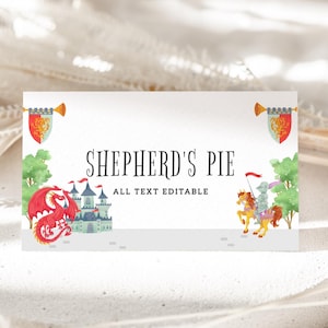 May include: A white card with the text "SHEPHERD'S PIE" and "ALL TEXT EDITABLE" in black. The card features illustrations of a red dragon, a castle, and a knight on horseback. Decorative banners are on each side.