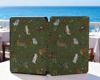 May include: A green tablet case featuring a repeating pattern of bunnies, flowers, and foliage. The bunnies are depicted in various colors, including white, brown, and gray. The case is open, revealing the interior.