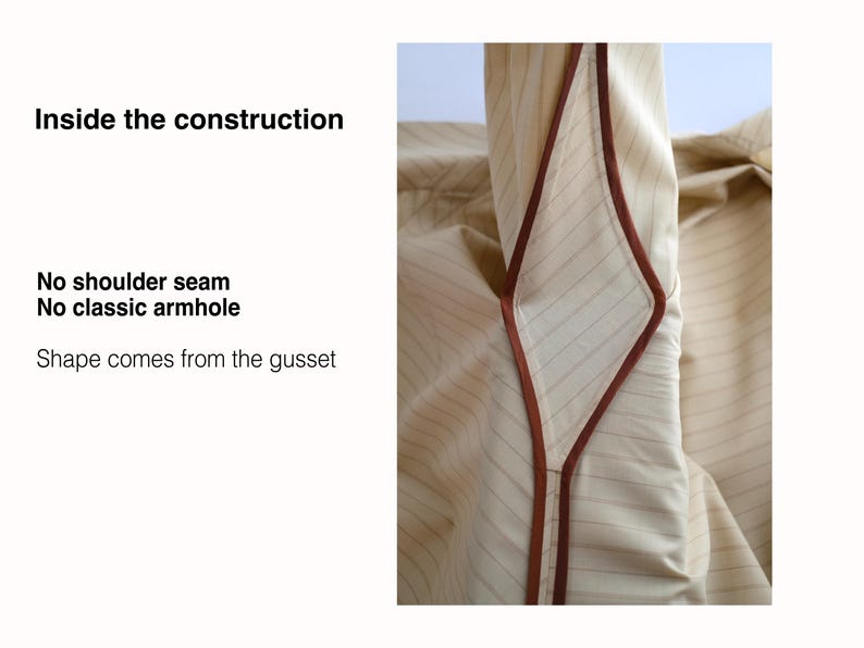 May include: A beige pinstriped garment featuring a diamond-shaped gusset with brown piping. Text on the left reads: Inside the construction, No shoulder seam, No classic armhole, Shape comes from the gusset. The design lacks traditional seams.