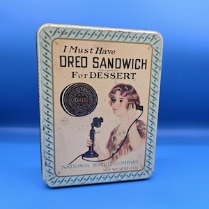 Vintage Nabisco Oreo-reclameblikje uit 1986 met een replica van een advertentie uit 1918.