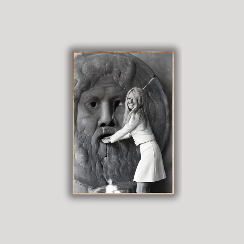 May include: A monochrome photograph featuring a woman in a white outfit touching a stone fountain sculpture of a bearded face. The image is framed within a wooden border.