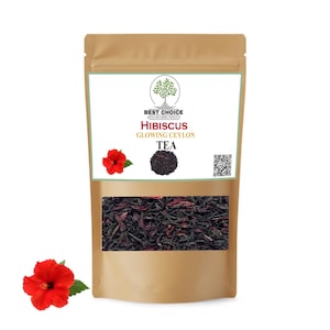 Könnte beinhalten: Ein beigefarbener Standbeutel mit Hibiscus Glowing Ceylon Tee. Das Etikett zeigt ein Baumlogo, den Text "BEST CHOICE", "HIBISCUS", "GLOWING CEYLON" und "TEA" sowie eine rote Hibiskusblüte, einen kleinen Haufen Teeblätter und einen QR-Code.
