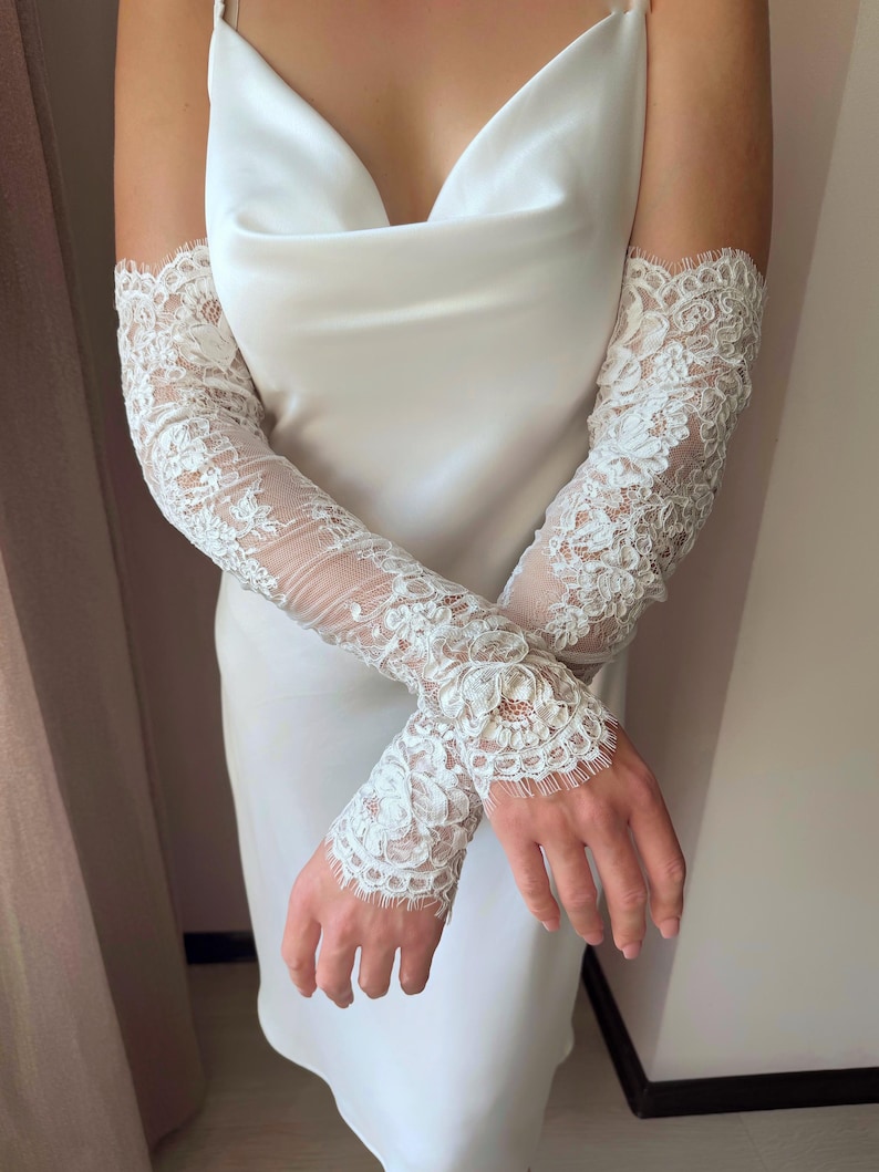 Elegant fingerless lace bridal gloves styled with modern slip wedding dress