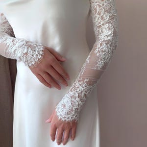 Long lace fingerless wedding sleeves for bride, delicate floral embroidery on mesh