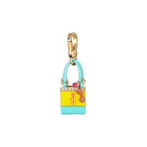 May include: A gold-tone charm with a turquoise handle and a yellow and turquoise handbag design. The handbag charm features a pink bow and the letter "J" with a heart. The charm is attached to a gold-tone clasp.