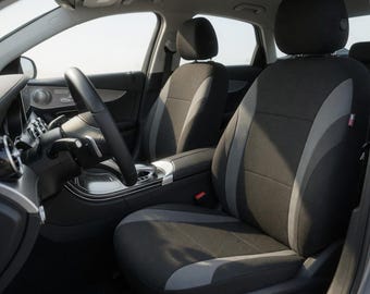 Fundas deportivas negras y grises para los asientos delanteros, compatibles con airbag y de ajuste universal.