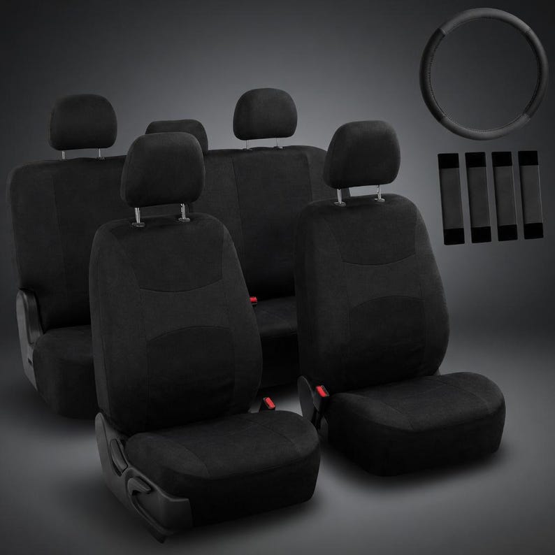 May include: A set of black car seat covers, including covers for the front and back seats, headrests, and seat belt covers. A black steering wheel cover is also included. The covers are made of a soft, textured material.
