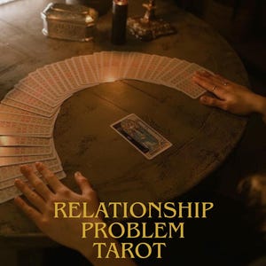 May include: A tarot card reading setup with a deck of cards fanned out on a wooden table. A single card is in the center, with the text "RELATIONSHIP PROBLEM TAROT" and "same day" in gold lettering.