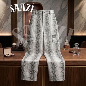 May include: Gray and white snake print pants with cargo pockets. The pants have a button and zipper closure and belt loops. The word "SAAZI" is printed in white at the top of the image.